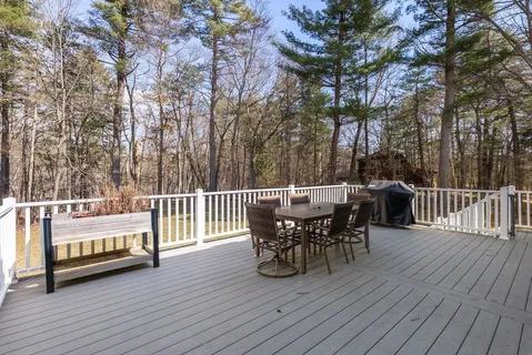 a view of a deck with table and chairs and wooden floor