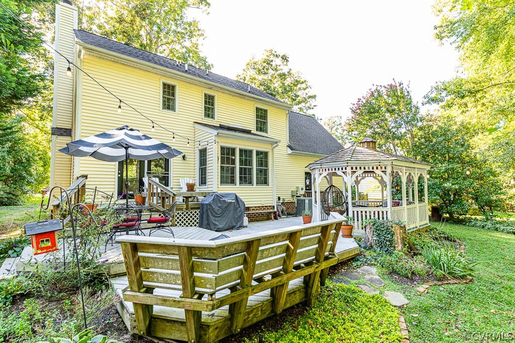 5421 Standing Oak Road Midlothian, VA 23112 - Photo 45 of 50 a front view of a house with sitting area and garden