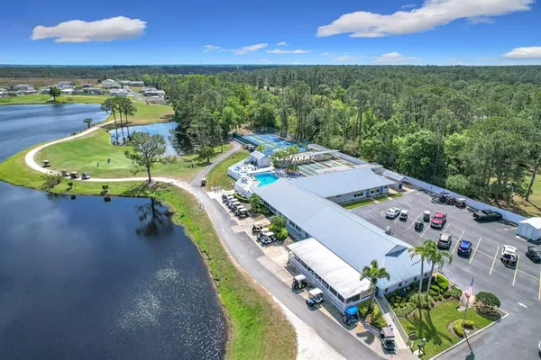 an aerial view of a house with outdoor space