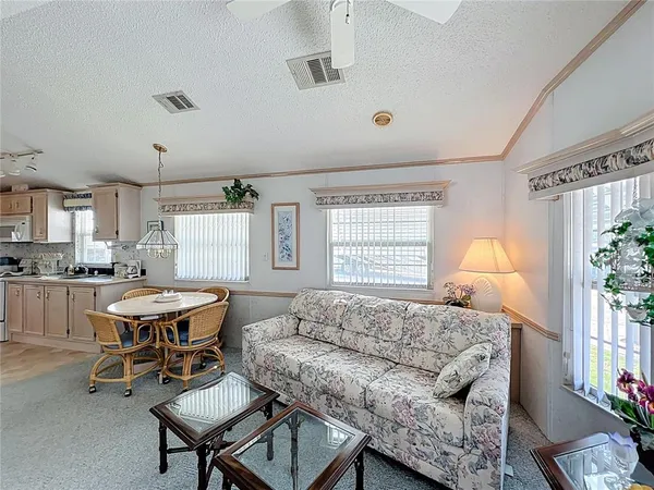 a living room with furniture and a table