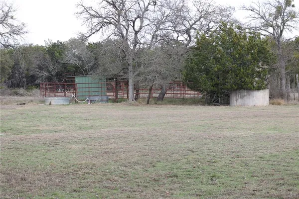a view of a swimming pool with a yard