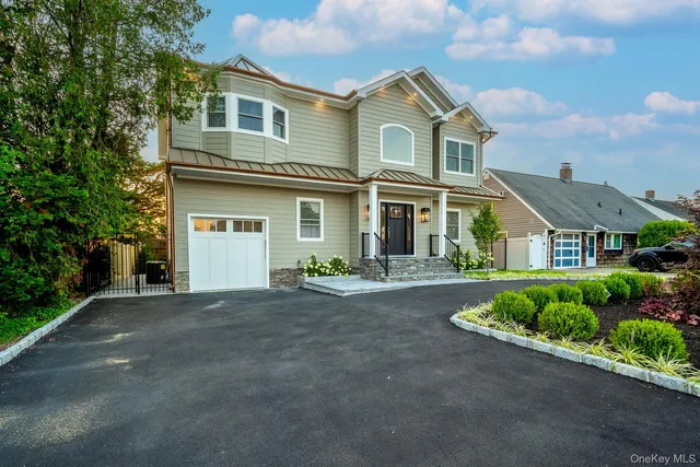 front view of a house with a street
