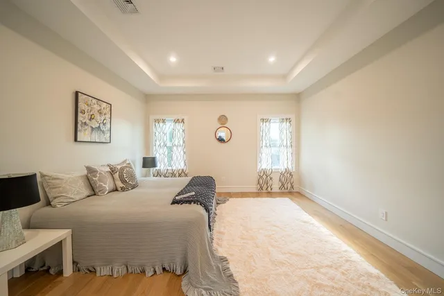 a bedroom with a large bed and a couch