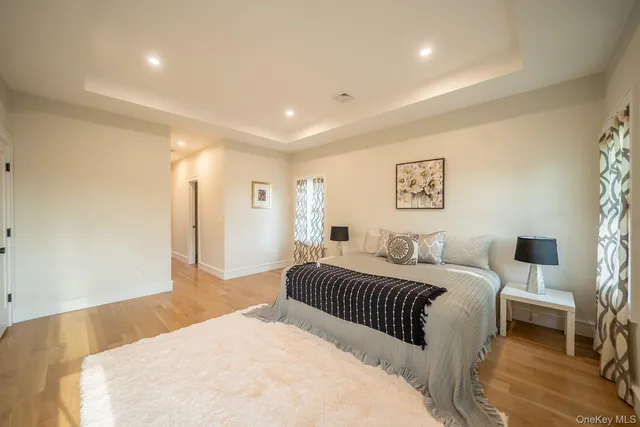 a bedroom with a large bed and a couch