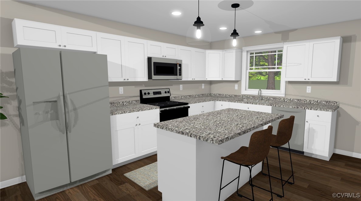 1833 Bumpass Road Bumpass, VA 23024 - Photo 16 of 25 Kitchen with white cabinets, a kitchen bar, applia