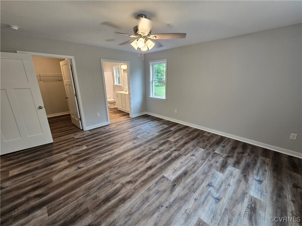 1833 Bumpass Road Bumpass, VA 23024 - Photo 8 of 25 Unfurnished bedroom with a spacious closet, basebo