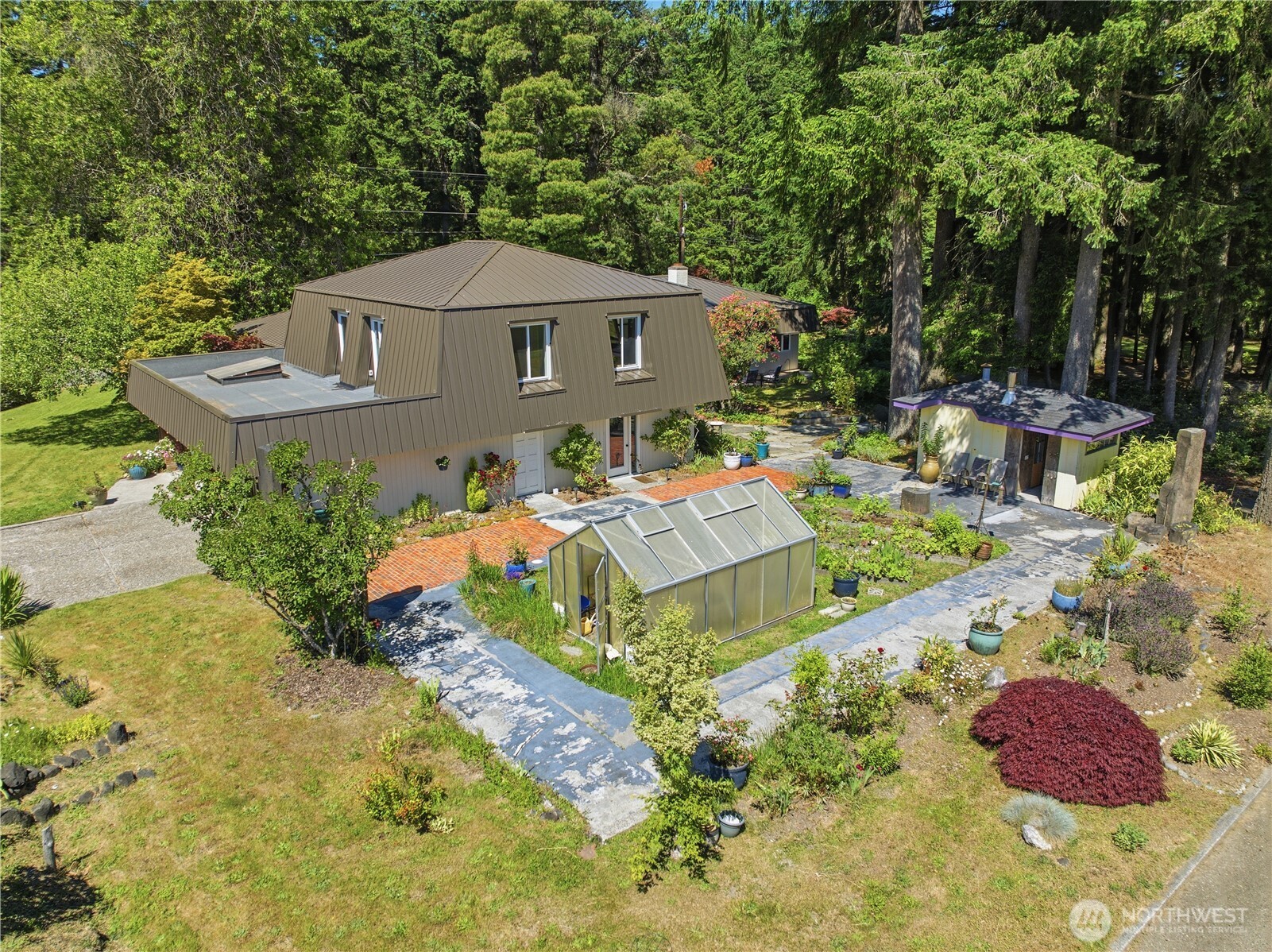 3050 Southeast Mullenix Road Port Orchard, WA 98367 - Photo 37 of 40 a aerial view of a house with yard and swimming pool