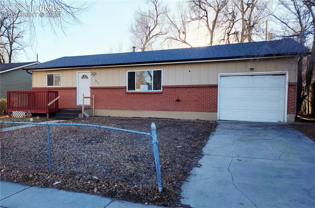 1214 Burnham Street Colorado Springs, CO 80906 - Photo 2 of 11 a front view of a house with garden