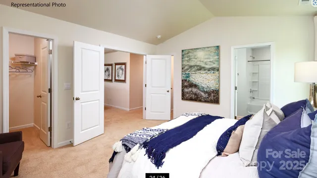 a bedroom with a large bed and a window