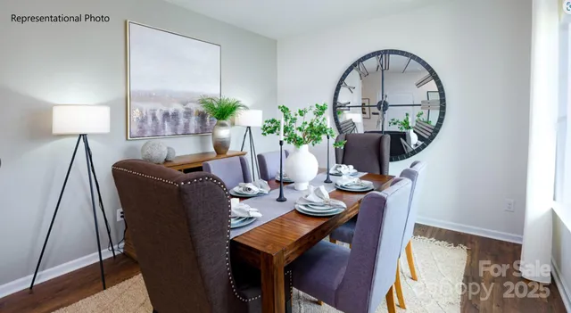 a living room with furniture a potted plant and a lamp