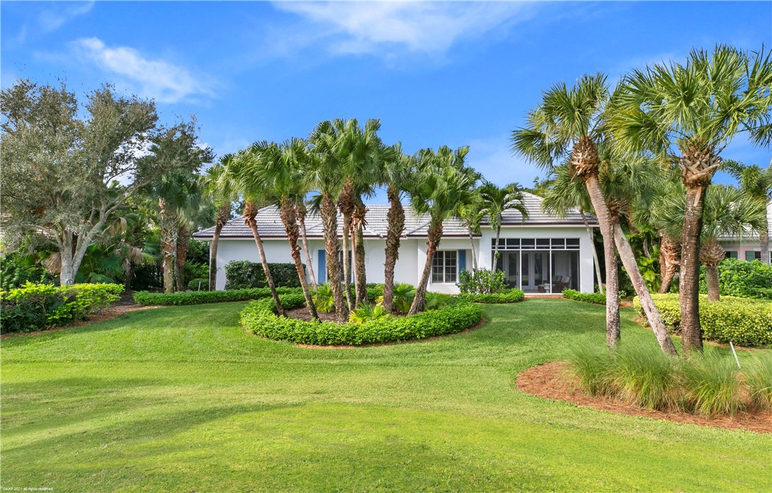 902 Orchid Point Way Vero Beach, FL 32963 - Photo 4 of 5 a front view of a house with a yard