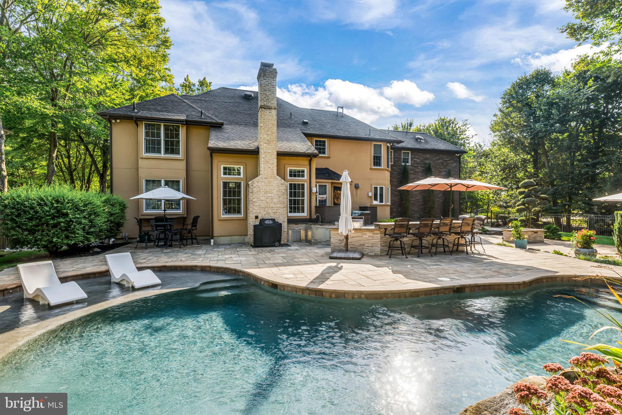 53 Stanwyck Road Mount Laurel, NJ 08054 - Photo 84 of 85 a patio with a table and chairs under an umbrella