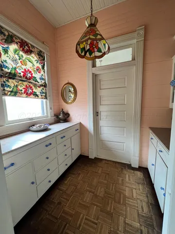 a bathroom with a sink a vanity and a large mirror