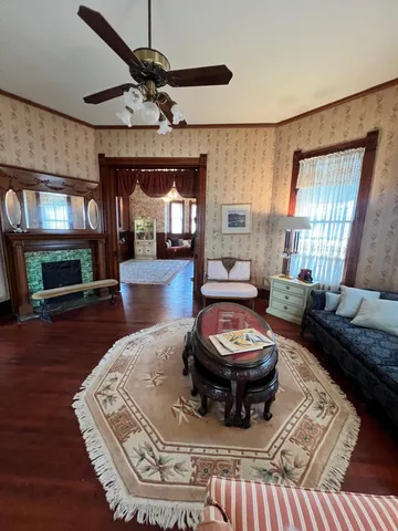 a living room with furniture and a fireplace