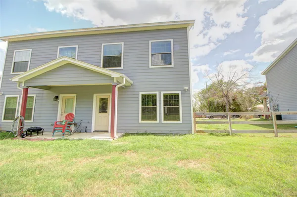 a front view of a house with a garden and porch