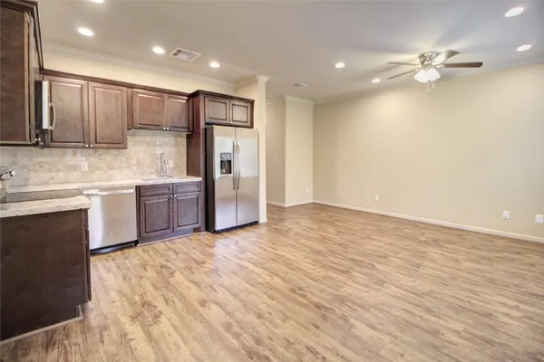 a view of kitchen with wooden floor