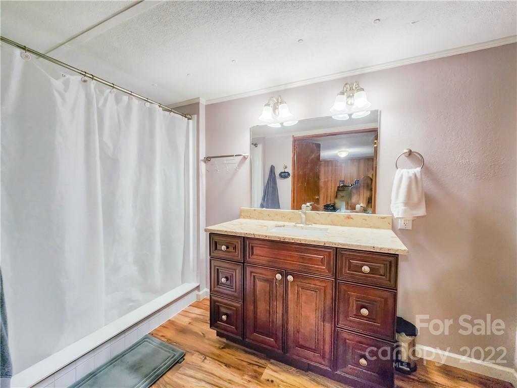 278 Pipers Neck Rutherfordton, NC 28139 - Photo 20 of 42 a bathroom with a granite countertop sink and a mirror