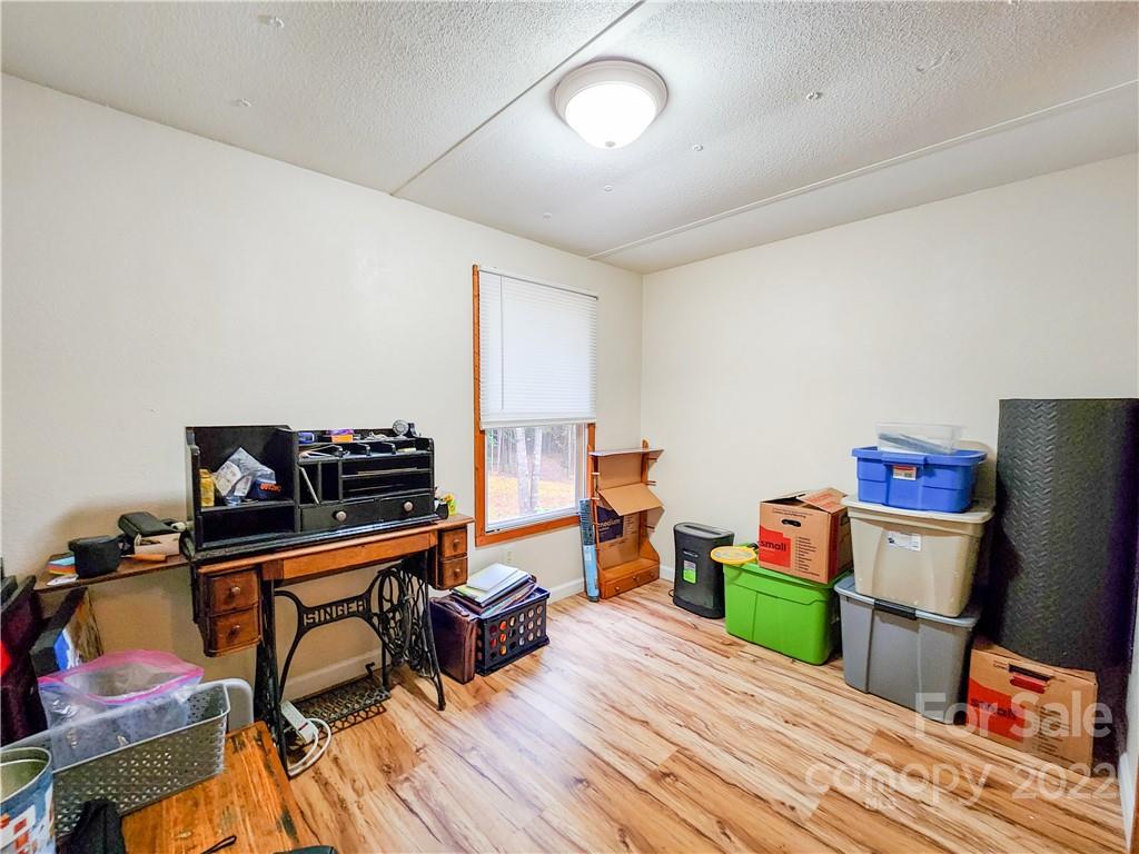 278 Pipers Neck Rutherfordton, NC 28139 - Photo 24 of 42 a room with furniture and a wooden floor