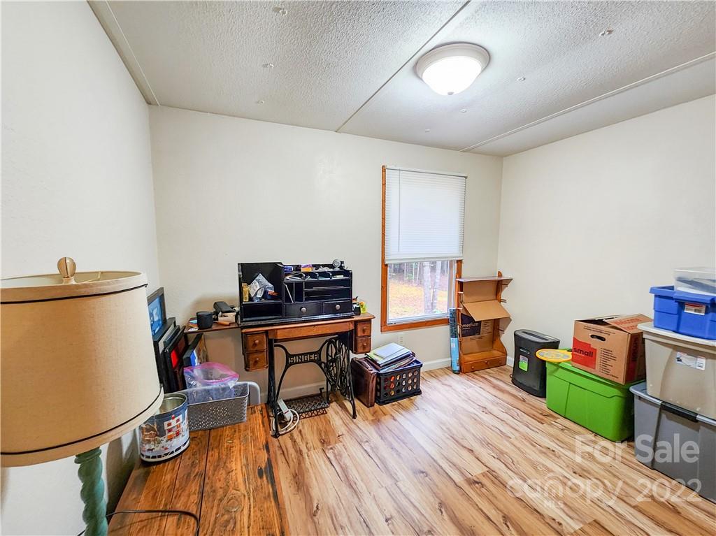 278 Pipers Neck Rutherfordton, NC 28139 - Photo 25 of 42 a view of a workspace with furniture and a wooden floor