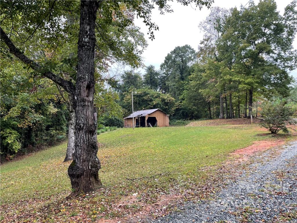 278 Pipers Neck Rutherfordton, NC 28139 - Photo 32 of 42 a backyard of a house with trees and entertaining space