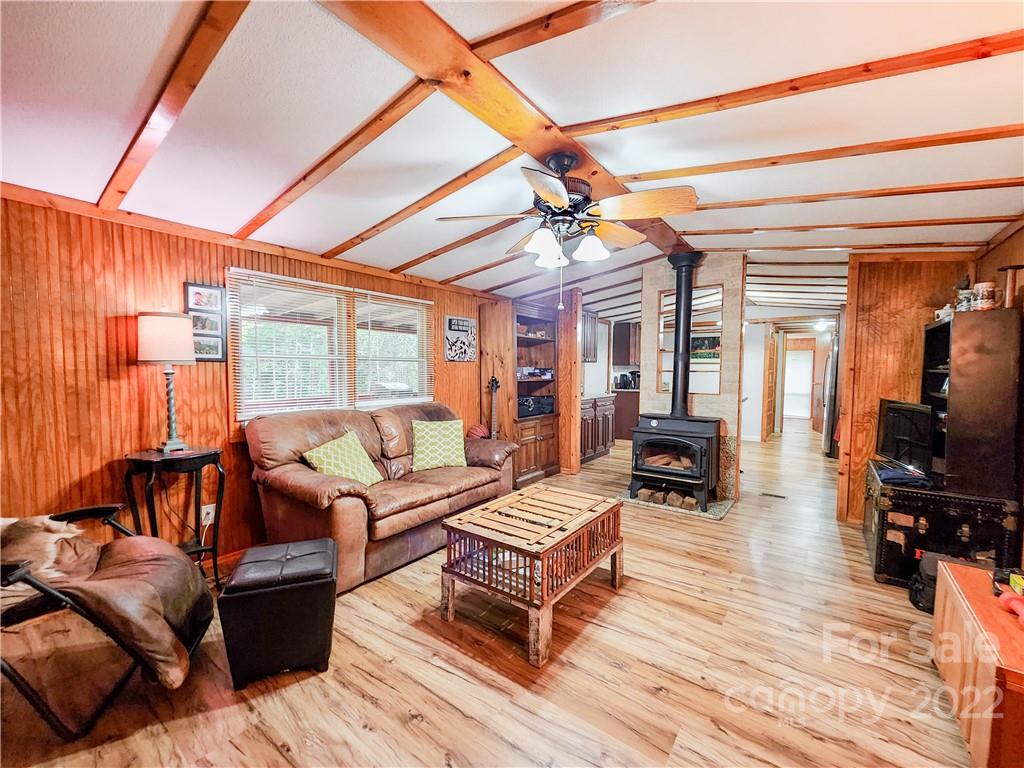 278 Pipers Neck Rutherfordton, NC 28139 - Photo 6 of 42 a living room with furniture a wooden floor and a large window