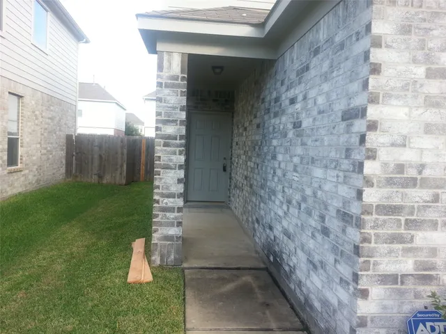 a view of a backyard of the house