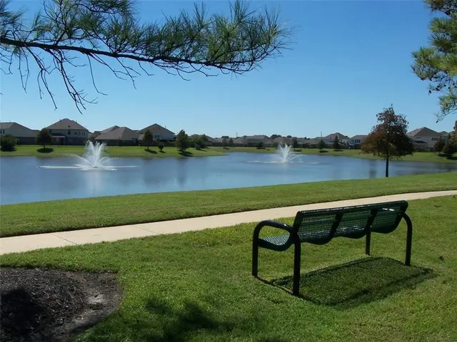 a view of a park with swings and slides