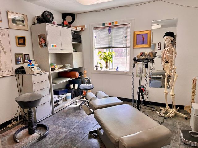 a living room with furniture a rug and a window