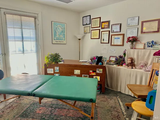 a room with furniture and a rug