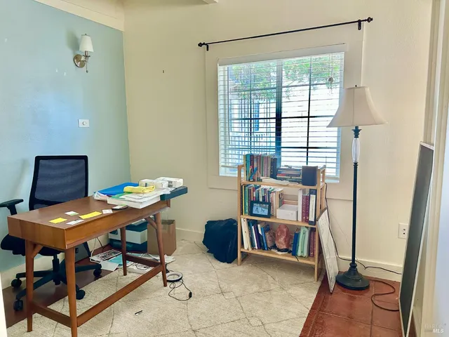a workspace with furniture and a window