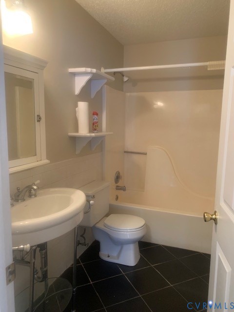 4100 Montclair Road Richmond, VA 23223 - Photo 5 of 8 a bathroom with a sink toilet a mirror and shower
