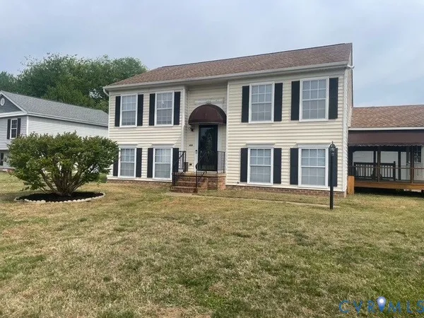 front view of a house with a yard