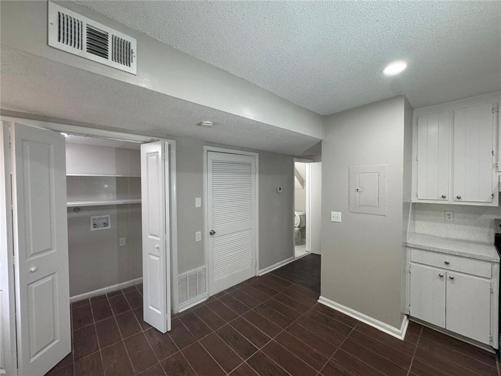 385 Holly Ridge Drive Northwest, Unit 5 Lilburn, GA 30047 - Photo 4 of 10 a view of an empty room and closet area