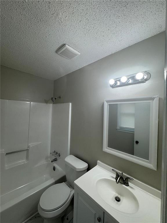 385 Holly Ridge Drive Northwest, Unit 5 Lilburn, GA 30047 - Photo 7 of 10 a bathroom with a sink a toilet and shower