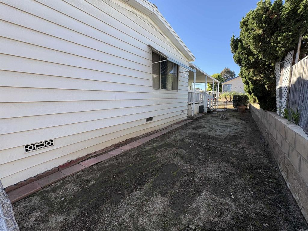 15420 Olde Highway 80 El Cajon, CA 92021 - Photo 13 of 48 a view of a house with a yard
