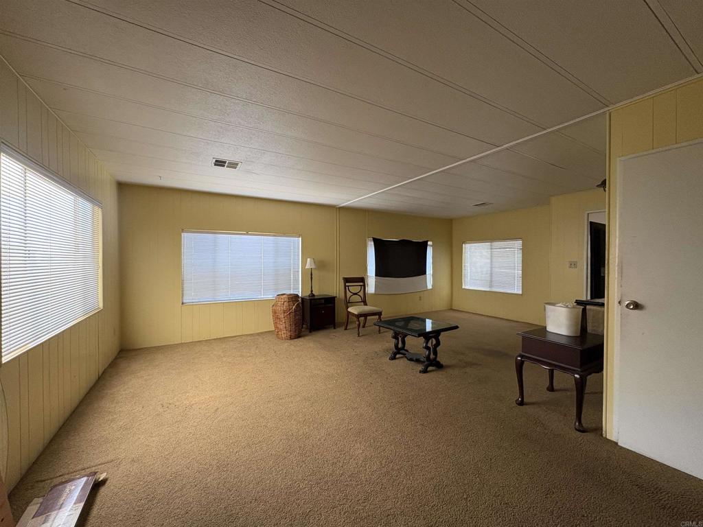 15420 Olde Highway 80 El Cajon, CA 92021 - Photo 25 of 48 a view of a livingroom with furniture and a flat screen tv
