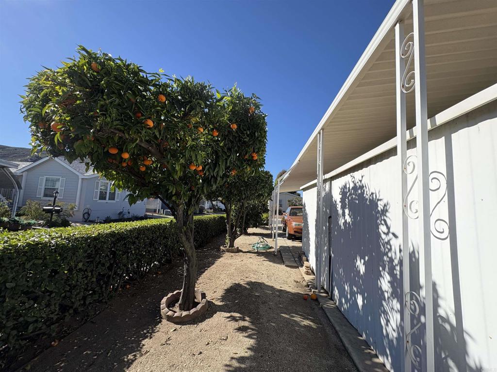 15420 Olde Highway 80 El Cajon, CA 92021 - Photo 3 of 48 a view of a house with a yard