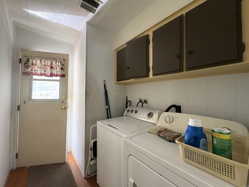 15420 Olde Highway 80 El Cajon, CA 92021 - Photo 39 of 48 a bedroom with a bed and wooden floor