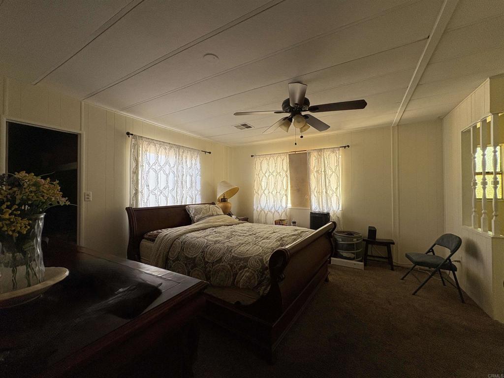 15420 Olde Highway 80 El Cajon, CA 92021 - Photo 40 of 48 a bedroom with bed and a window