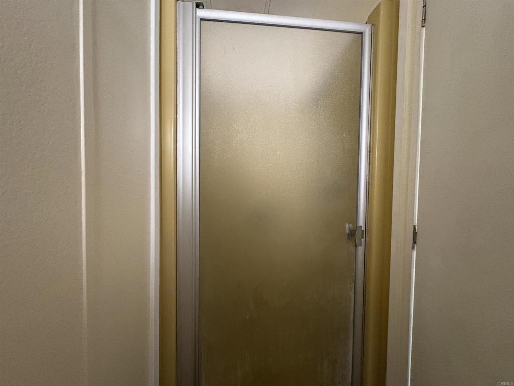 15420 Olde Highway 80 El Cajon, CA 92021 - Photo 44 of 48 a bathroom with a glass shower door