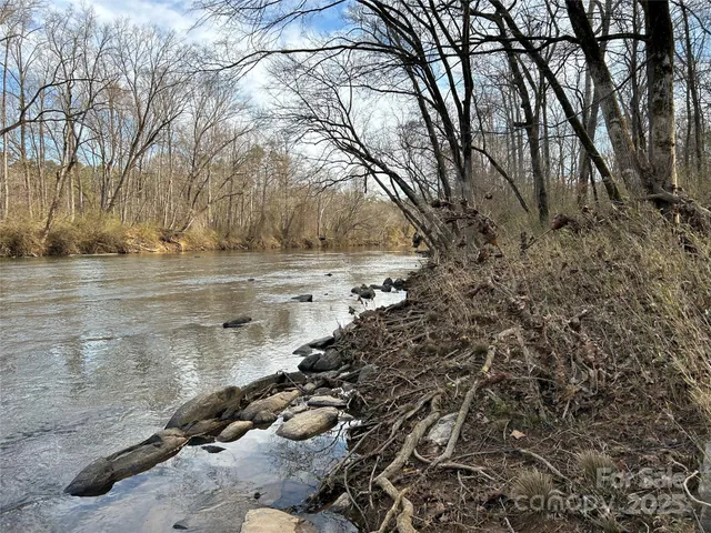 a view of a lake with a yard