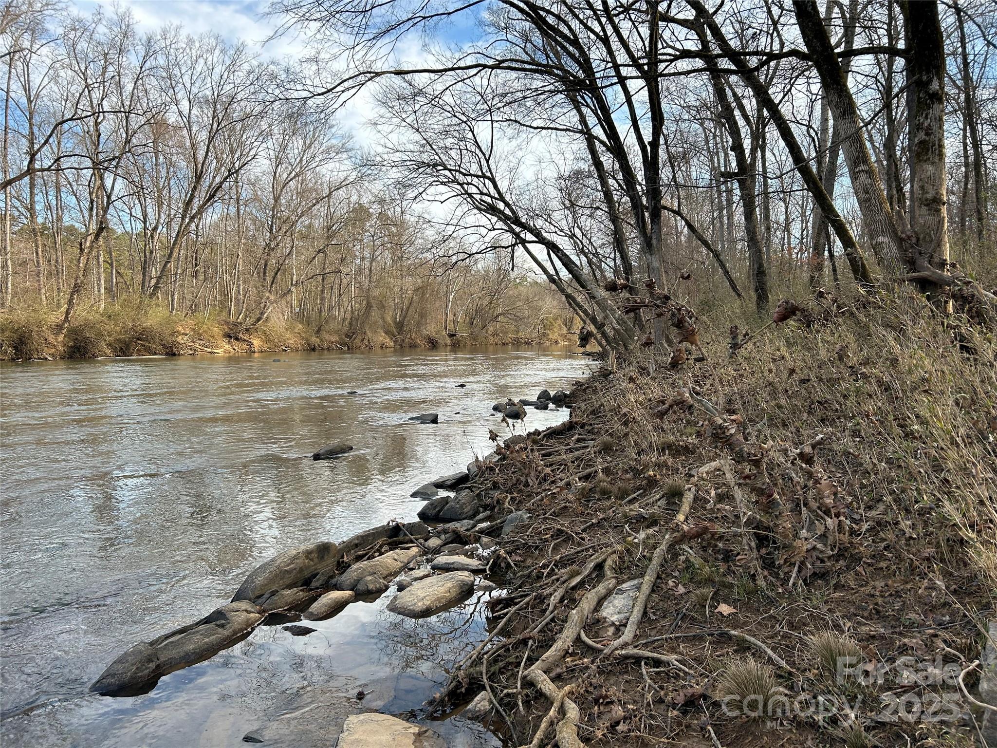 7718 Pleasant Hill Church Road Marshville, NC 28103 - Photo 11 of 17 a view of a lake with a yard