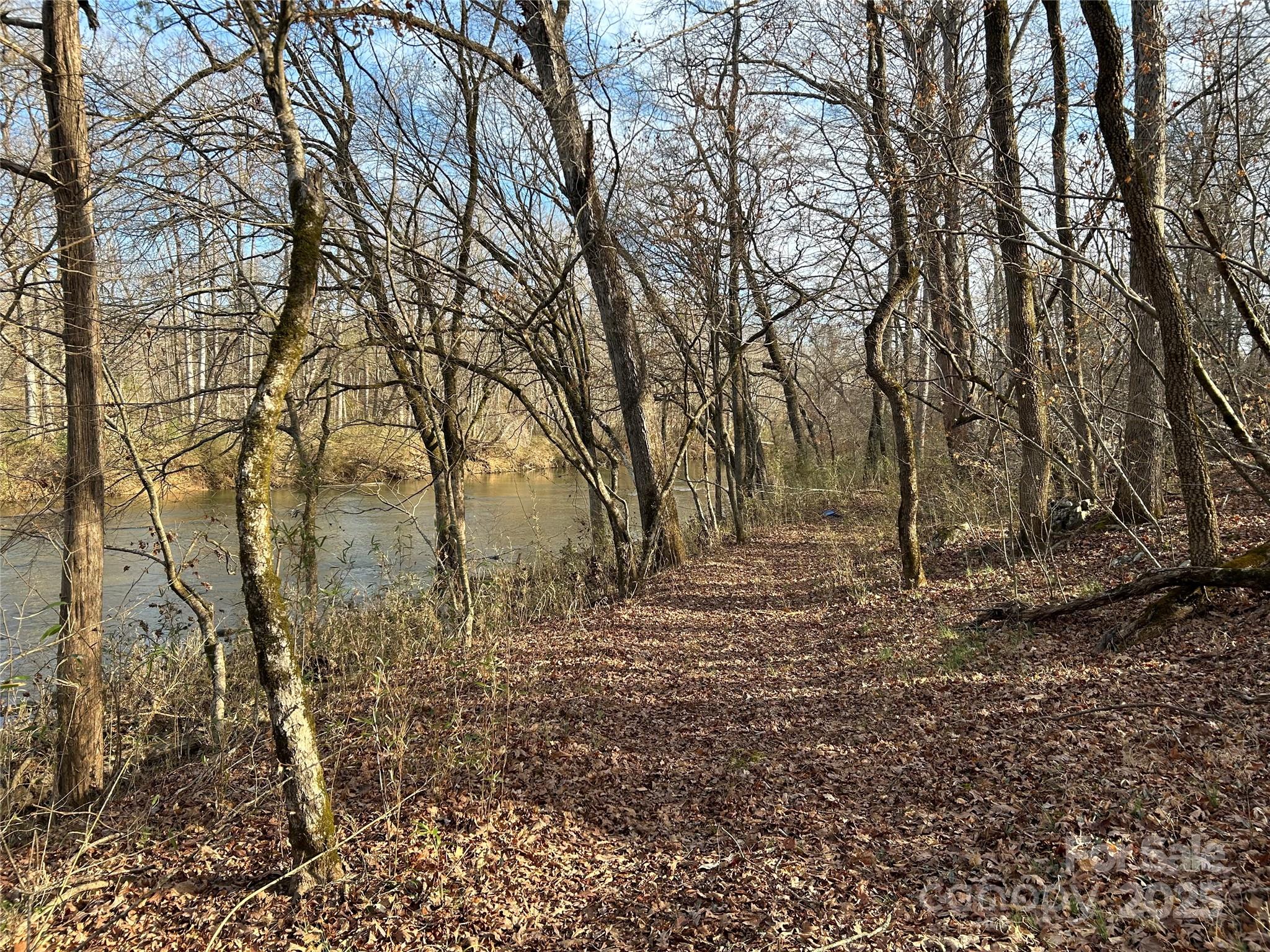 7718 Pleasant Hill Church Road Marshville, NC 28103 - Photo 12 of 17 a backyard of a house with lots of green space