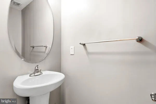 a bathroom with a sink a mirror and a shower