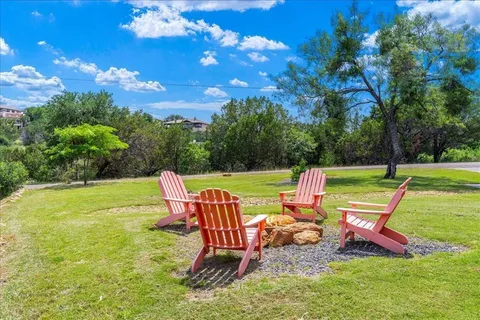 a view of a two chairs in a yard