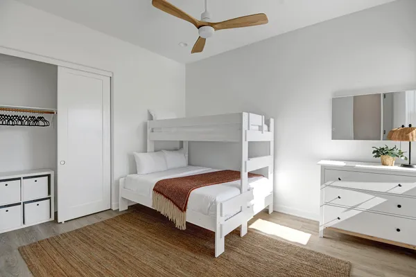 a bedroom with a bed and a dresser