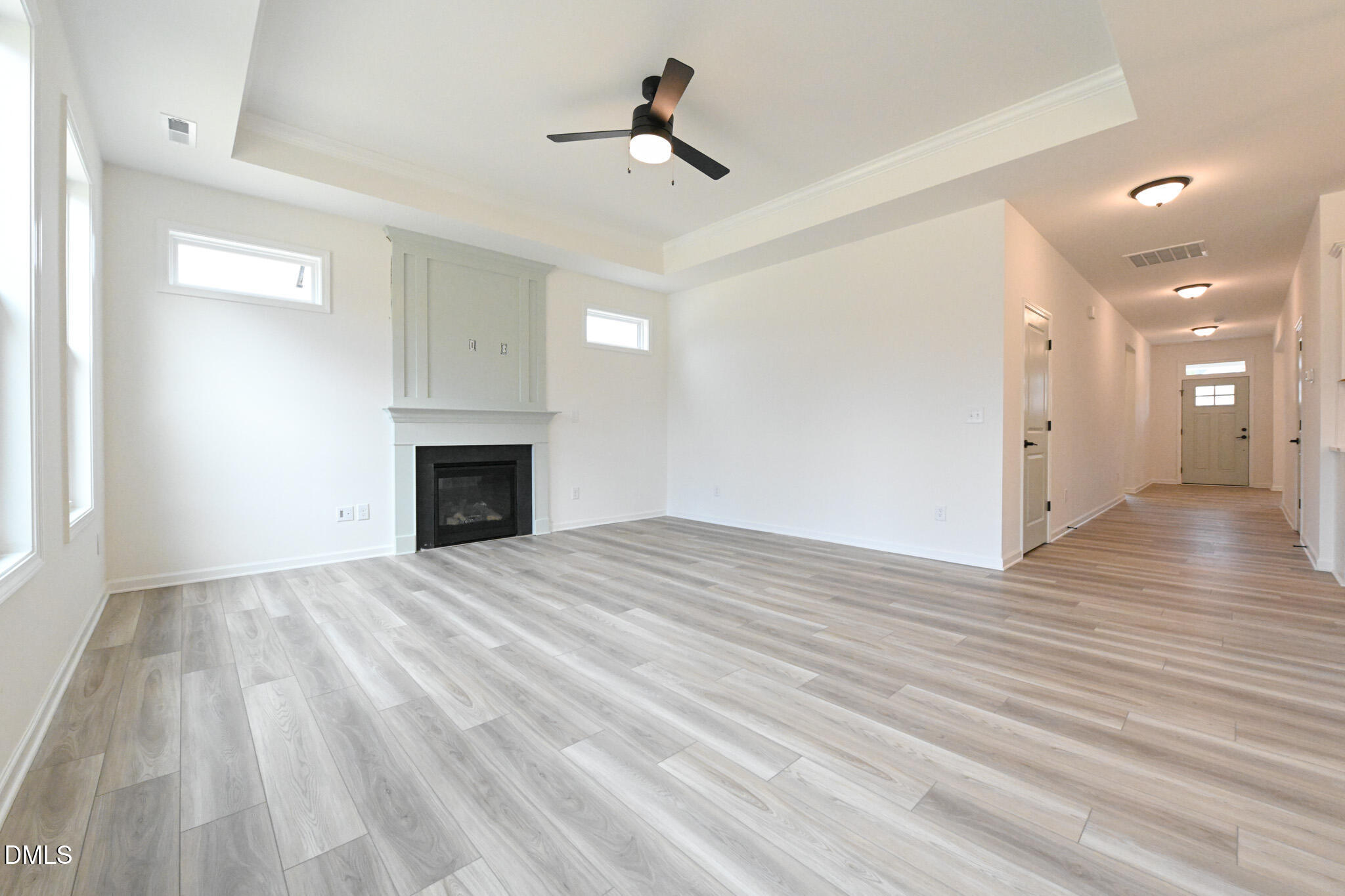 72 South Bream Court Angier, NC 27501 - Photo 12 of 44 a view of empty room with wooden floor and fireplace