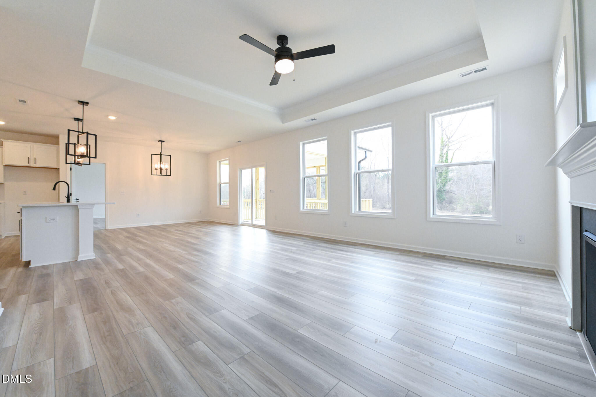 72 South Bream Court Angier, NC 27501 - Photo 13 of 44 a view of an empty room with a window and wooden floor