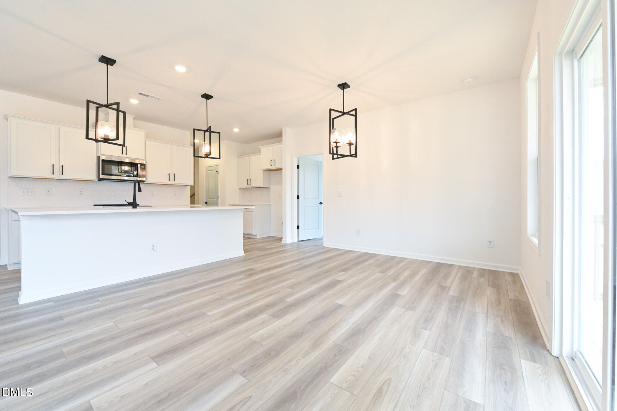 72 South Bream Court Angier, NC 27501 - Photo 15 of 44 a view of a kitchen with wooden floor and windows