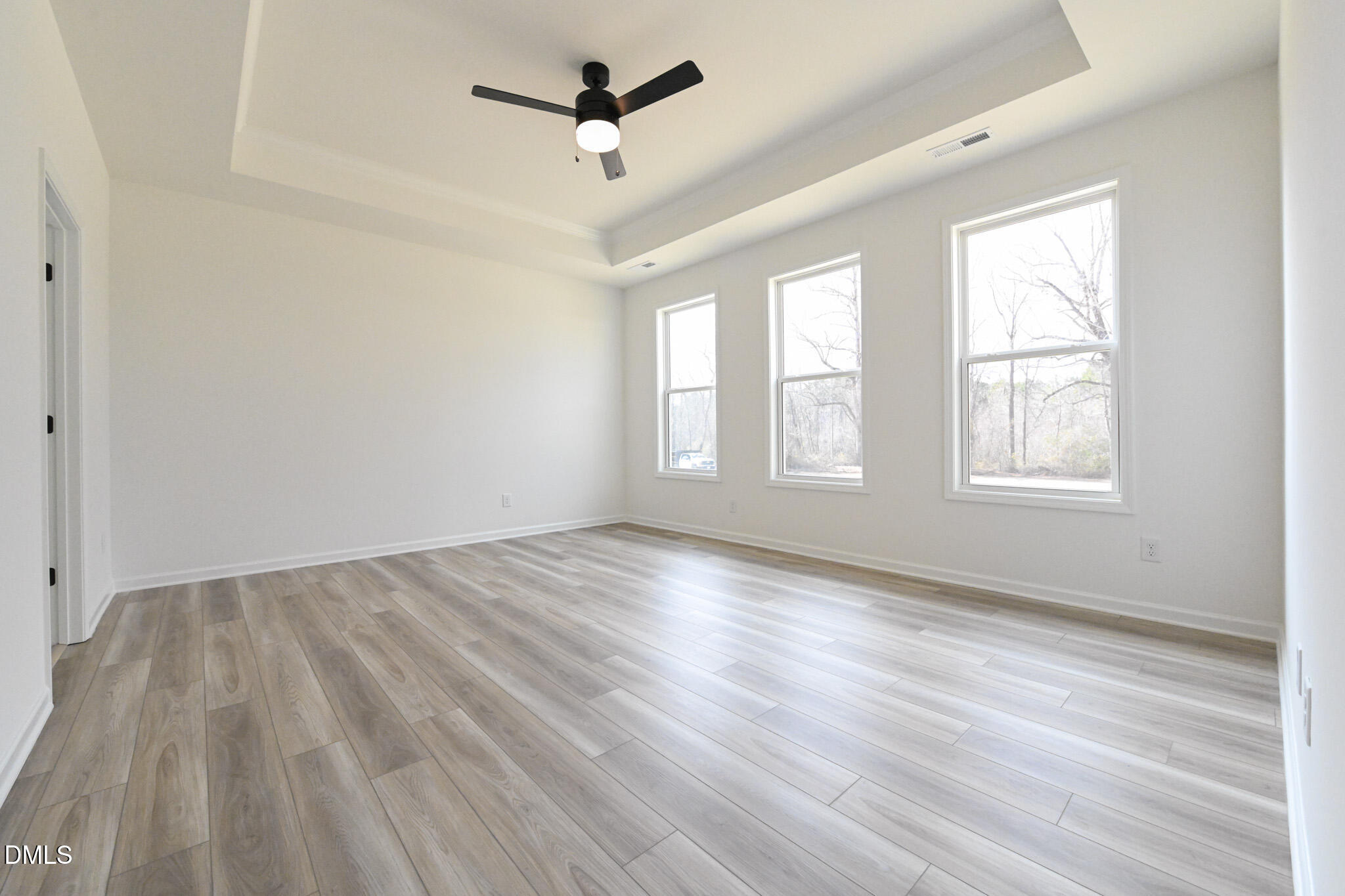 72 South Bream Court Angier, NC 27501 - Photo 25 of 44 a view of empty room with wooden floor and fan